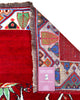 Tappeto Gashgai 185x111 cm annodato a mano, con cavalli stilizzati bianchi su fondo rosso e cornice geometrica multicolore.