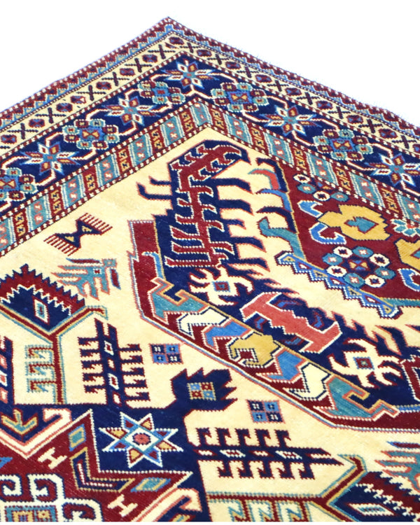 Tappeto Shirvan Afghan 164x117 cm, annodato a mano, con campo avorio, medaglione geometrico centrale e bordo decorato.