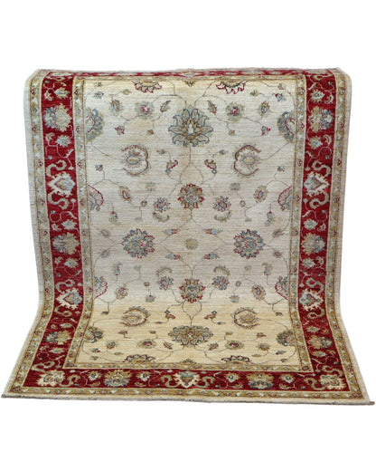 Tappeto Ziegler 175x127 cm, annodato a mano, fondo avorio con motivi floreali stilizzati e cornice rosso rubino.