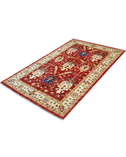 Tappeto Ziegler 170x120 cm con fondo rosso bordeaux e motivi floreali avorio e blu, tramato ed annodato a mano, provenienza Afghanistan.