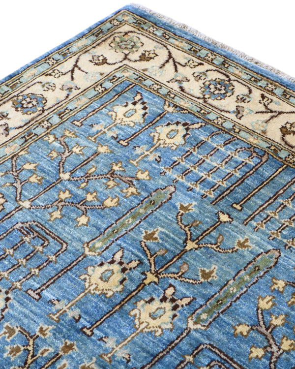 Tappeto Ziegler 188x123 cm con disegno floreale su fondo azzurro e bordura beige, perfetto per arredamenti eleganti e moderni.