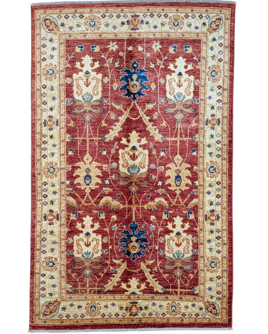 Tappeto Ziegler 170x120 cm con fondo rosso bordeaux e motivi floreali avorio e blu, tramato ed annodato a mano, provenienza Afghanistan.