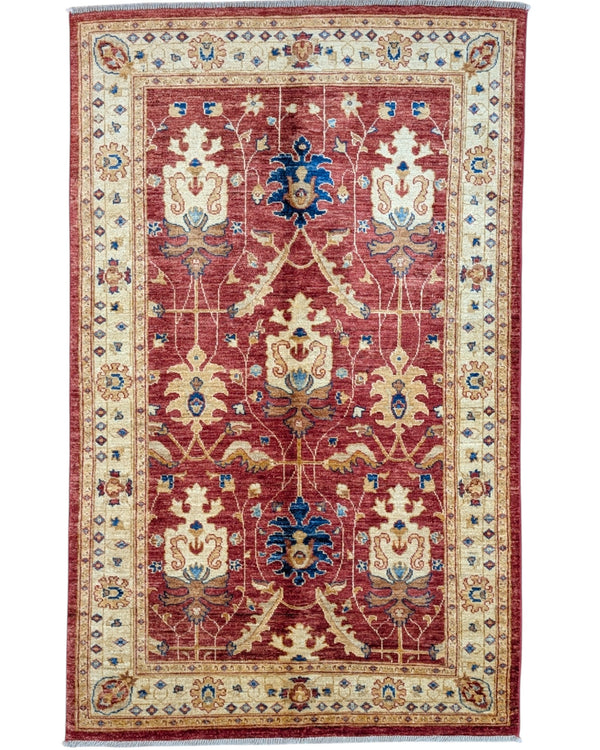 Tappeto Ziegler 170x120 cm con fondo rosso bordeaux e motivi floreali avorio e blu, tramato ed annodato a mano, provenienza Afghanistan.