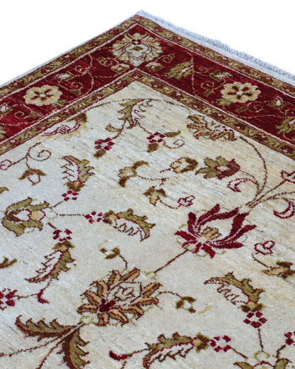 Tappeto Ziegler 195x135 cm in lana, annodato a mano, fondo avorio con disegni floreali e cornice rosso rubino.