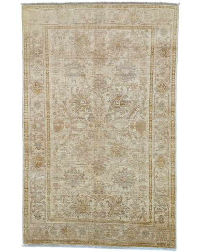 Tappeto Ziegler 185x120 cm annodato a mano con motivi floreali su fondo beige chiaro e bordura avorio.