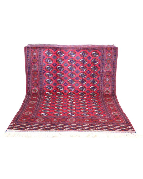 Tappeto Bukhara 278x180 cm con fondo rosso e motivi a gul in nero e avorio, tramato ed annodato a mano, provenienza Asia Centrale.