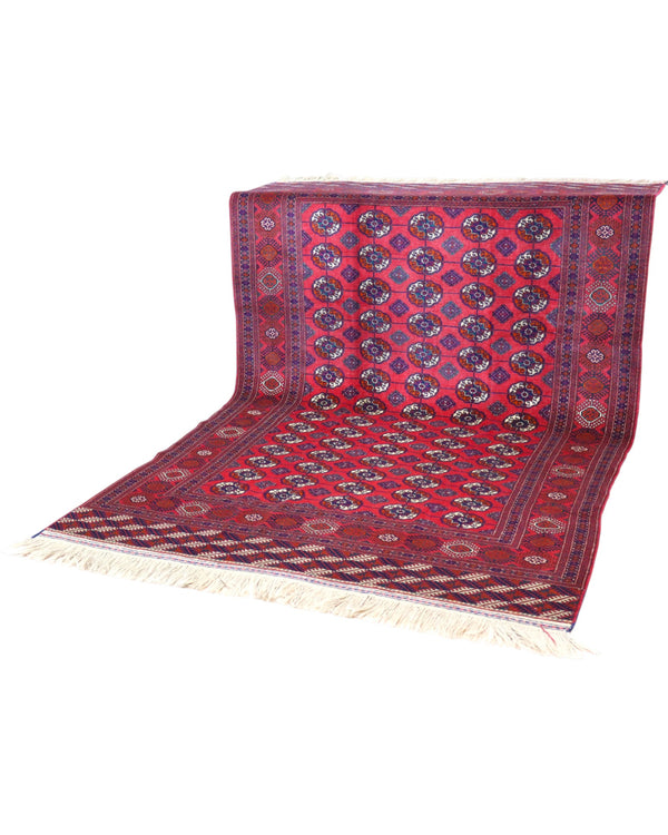 Tappeto Bukhara 278x180 cm con fondo rosso e motivi a gul in nero e avorio, tramato ed annodato a mano, provenienza Asia Centrale.