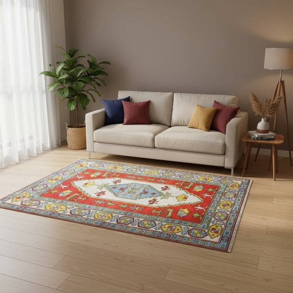 Tappeto Caucaso rosso con motivi geometrici tradizionali, annodato a mano in Turchia in pura lana tinta con colori vegetali.