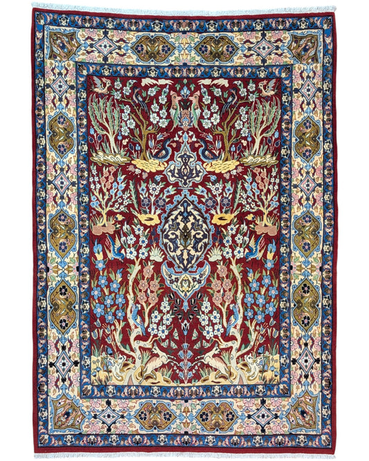 Tappeto Esfahan persiano “Giardino Incantato”, annodato a mano, fondo rosso melograno con alberi, cervi e uccelli, lana tinta vegetale, certificato di autenticità incluso.