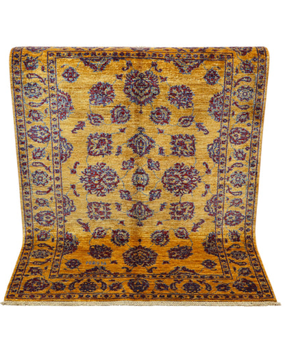 Tappeto Farahan Ziegler oro e blu notte, annodato a mano in Afghanistan. Realizzato in lana e cotone con colori vegetali, unisce eleganza floreale e tradizione artigianale.