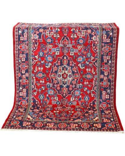 Tappeto Hamedan 190x127 cm annodato a mano, rettangolare, fondo rosso con motivi floreali e geometrici, realizzato in cotone e lana con colori vegetali.
