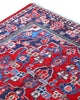 Tappeto Hamedan 190x127 cm annodato a mano, rettangolare, fondo rosso con motivi floreali e geometrici, realizzato in cotone e lana con colori vegetali.