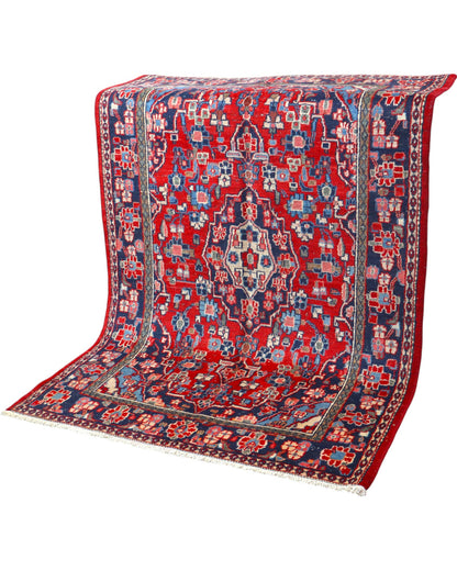 Tappeto Hamedan 190x127 cm annodato a mano, rettangolare, fondo rosso con motivi floreali e geometrici, realizzato in cotone e lana con colori vegetali.