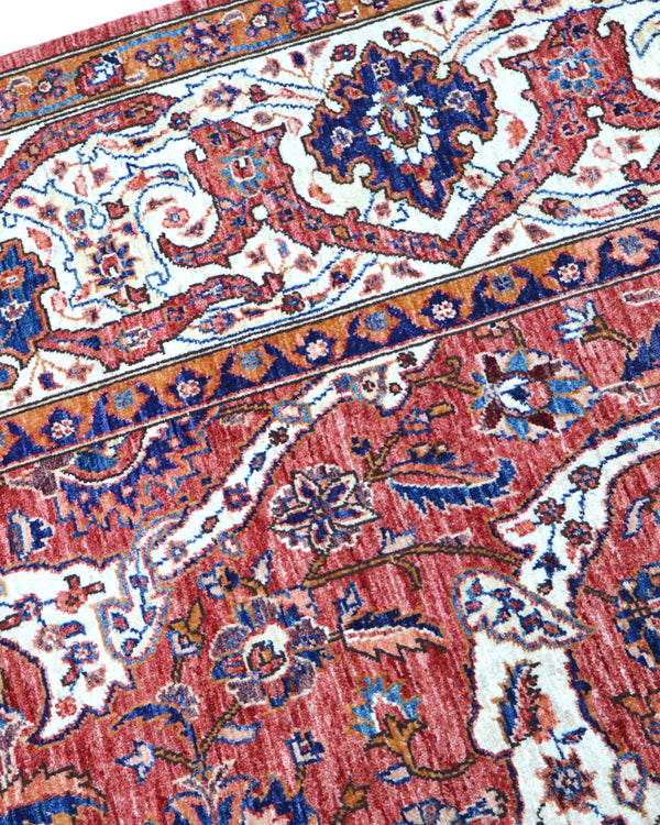 Tappeto Heriz marrone bruciato con cornice beige e motivi decorativi, annodato a mano in Persia con lana e cotone tinti con colori vegetali.