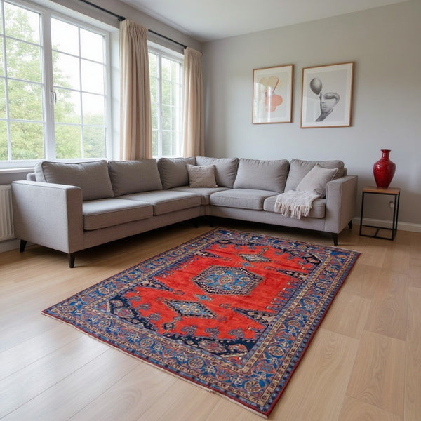 Tappeto Heriz persiano 339x219 cm, annodato a mano su telaio tradizionale, lana e cotone con colori vegetali, fondo rosso e dettagli blu.