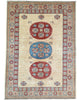 Tappeto Kazak rettangolare 200x146 cm, campo beige con motivo geometrico e cornice decorata, annodato a mano in lana e cotone con colori vegetali, provenienza Afghanistan.