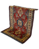 Tappeto Kazak rosso con cornice beige e motivi geometrici, annodato a mano in Afghanistan in lana e cotone con colori vegetali.