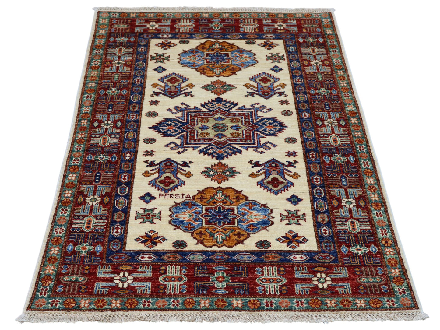 Tappeto Shirvan 145x100 cm, annodato a mano, lana pregiata con motivi geometrici e floreali caucasici.