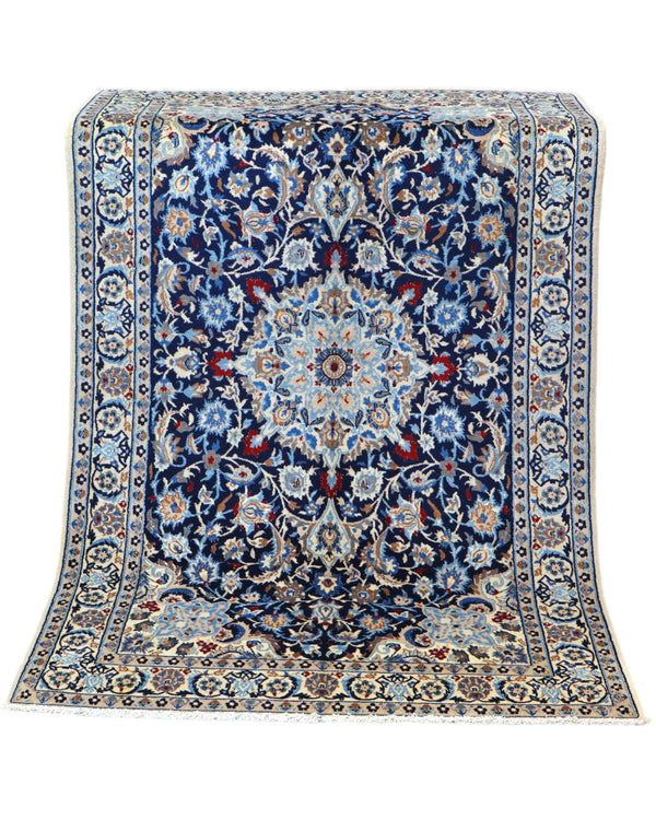 Tappeto Nain 9 fili 191x120 cm annodato a mano, rettangolare, in lana e cotone con colori vegetali, design floreale persiano su fondo blu scuro.