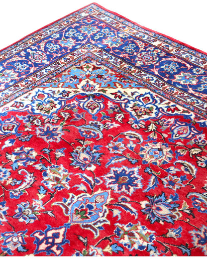 Tappeto Najafabad persiano 350x231 cm, annodato a mano in lana e cotone con colori vegetali, fondo rosso e dettagli blu e avorio.
