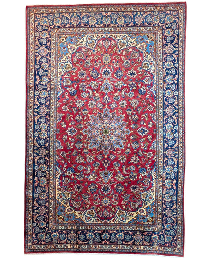 Tappeto Najafabad persiano 350x231 cm, annodato a mano in lana e cotone con colori vegetali, fondo rosso e dettagli blu e avorio.
