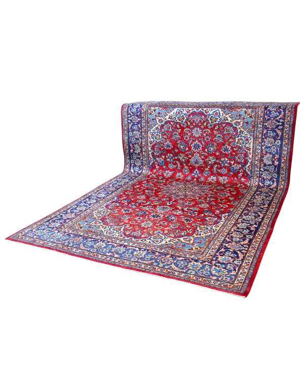 Tappeto Najafabad persiano 350x231 cm, annodato a mano in lana e cotone con colori vegetali, fondo rosso e dettagli blu e avorio.
