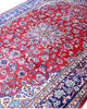 Tappeto Najafabad persiano 350x231 cm, annodato a mano in lana e cotone con colori vegetali, fondo rosso e dettagli blu e avorio.
