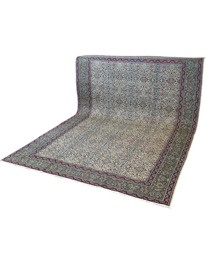 Tappeto Ushak turco 296x198 cm con fondo chiaro e motivi floreali e geometrici in rosa, blu e verde, tramato ed annodato a mano, provenienza Turchia.