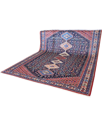 Tappeto Yalame persiano 346x265 cm, annodato a mano in lana e cotone, fondo blu con disegni geometrici tradizionali.