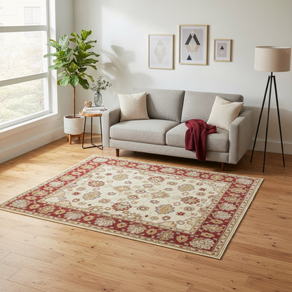 Tappeto Ziegler beige con cornice rossa e motivi floreali decorativi, annodato a mano in Afghanistan con lana e cotone tinti con colori vegetali.