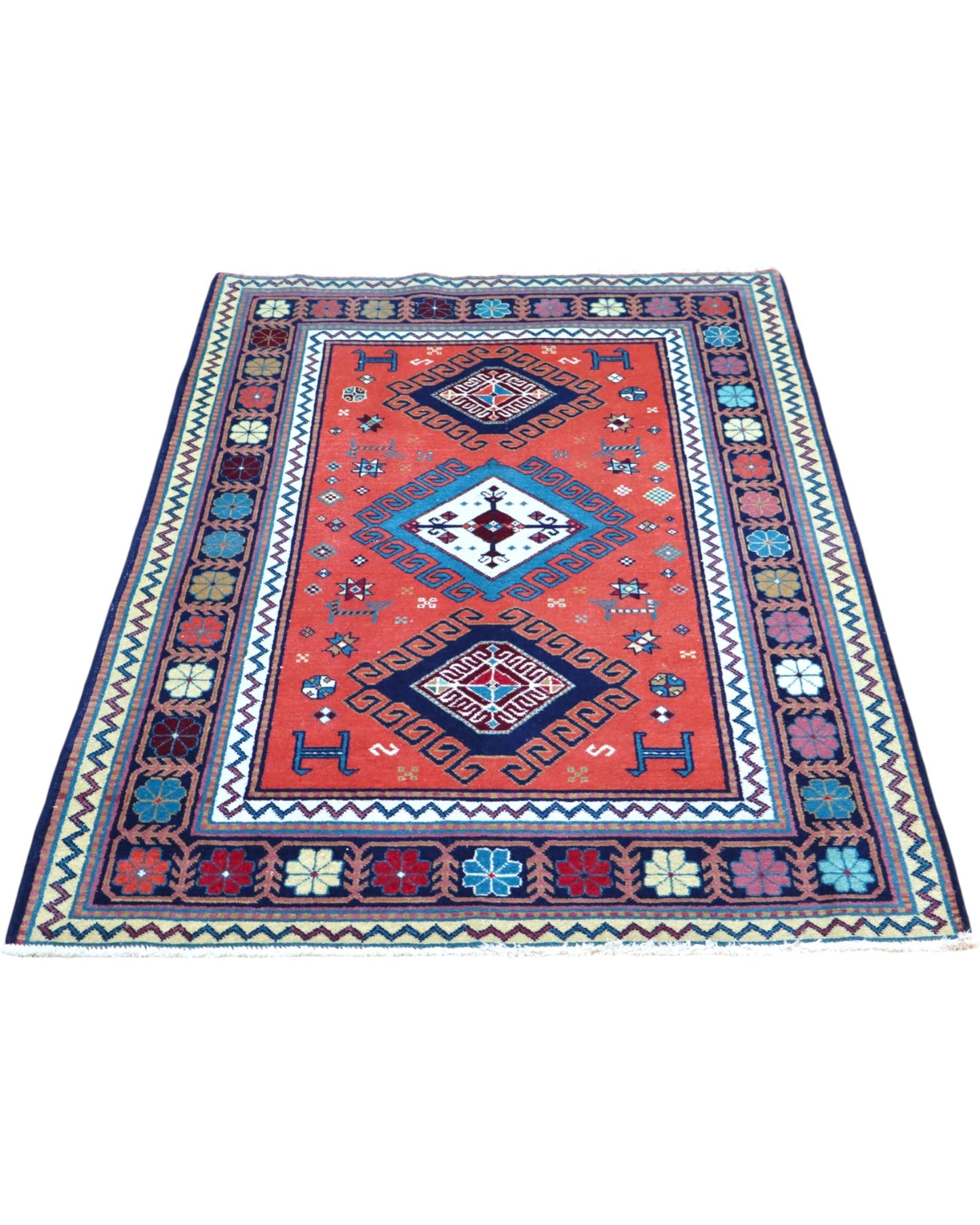 Tappeto caucasico 167x117 cm rosso con motivi geometrici in soggiorno elegante