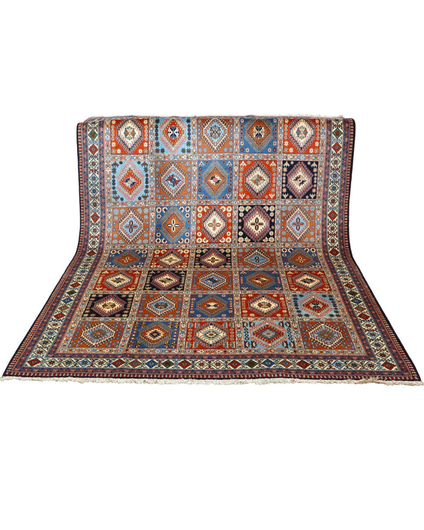 "Tappeto Yalameh annodato a mano con motivi geometrici in marrone, blu, rosso, giallo e crema, 290x204 cm."