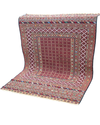 Tappeto Sumakh 184x126 cm con fondo bordeaux e motivi geometrici multicolori, annodato a mano, tradizione caucasica.