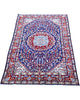 Elegante tappeto Kerman 152x96 cm con dettagli floreali e tonalità di blu.