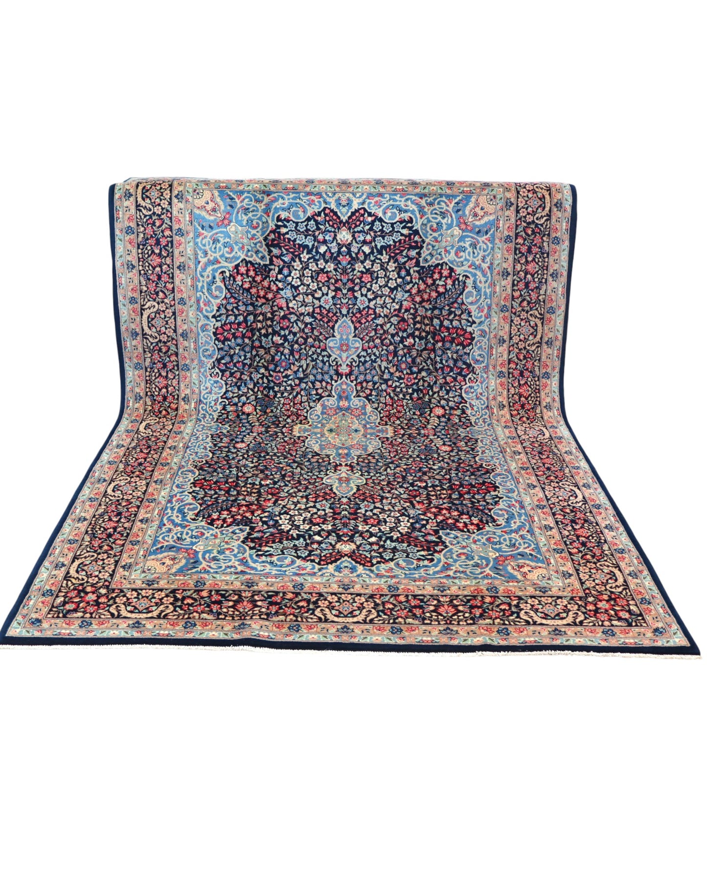 "Tappeto Kerman annodato a mano con motivi floreali in rosso, blu e avorio su fondo blu, 280x189 cm."