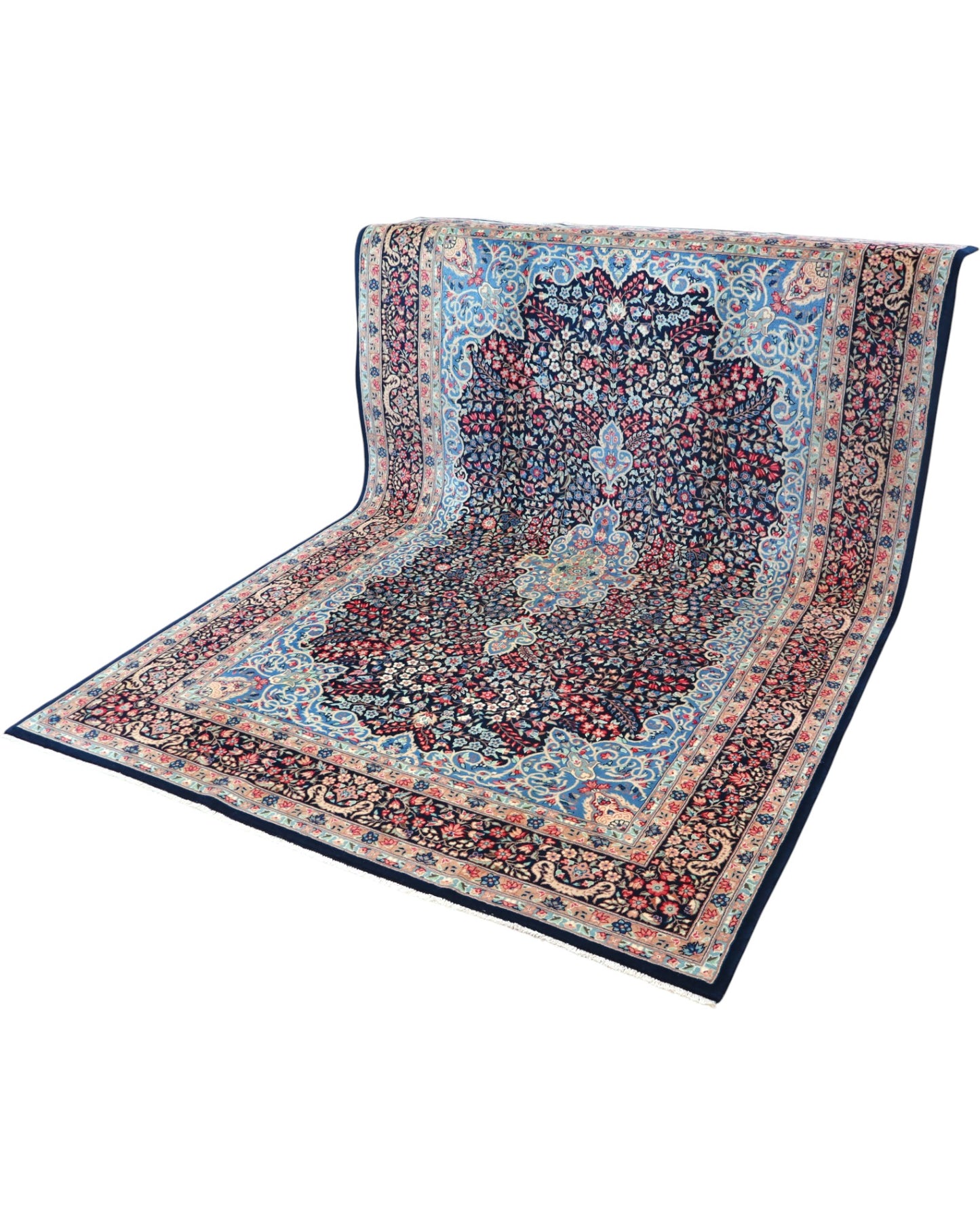 "Tappeto Kerman annodato a mano con motivi floreali in rosso, blu e avorio su fondo blu, 280x189 cm."