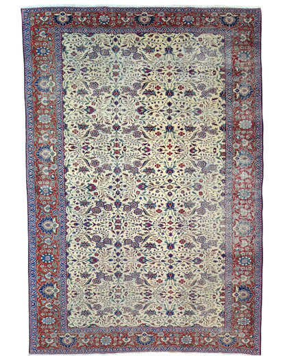 "Tappeto Turk annodato a mano con motivi floreali nei toni del blu, rosso e verde su fondo avorio, 294x201 cm."