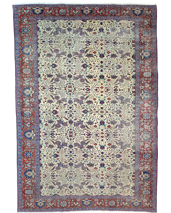 "Tappeto Turk annodato a mano con motivi floreali nei toni del blu, rosso e verde su fondo avorio, 294x201 cm."