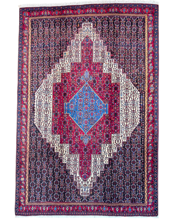 "Tappeto Sannhe annodato a mano con motivi geometrici e floreali in rosso, blu e bianco, 300x200 cm."