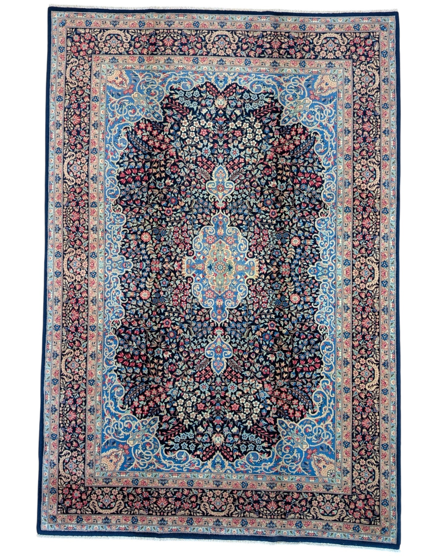 "Tappeto Kerman annodato a mano con motivi floreali in rosso, blu e avorio su fondo blu, 280x189 cm."