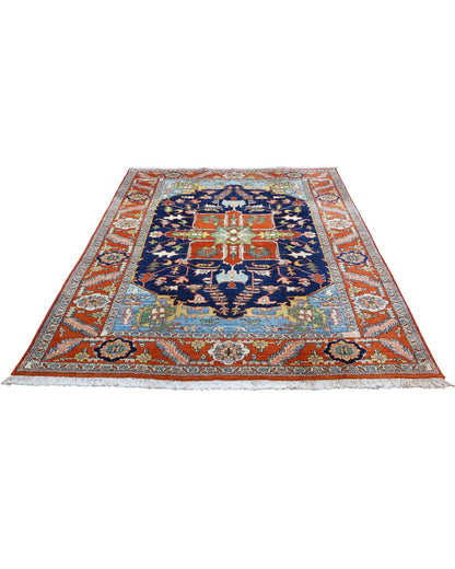 "Tappeto Heriz persiano blu e terracotta con medaglione geometrico, 290x205 cm."