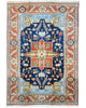 "Tappeto Heriz persiano blu e terracotta con medaglione geometrico, 290x205 cm."