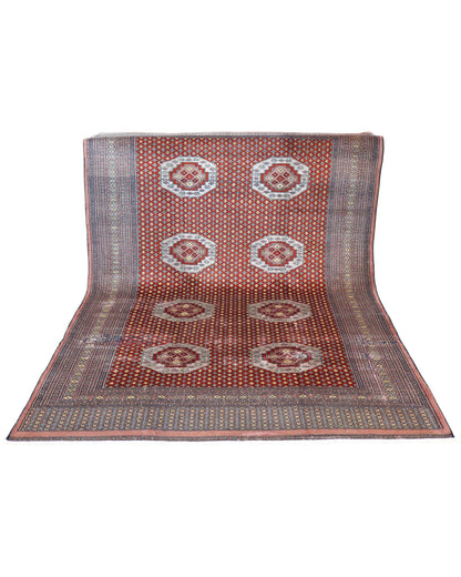 "Tappeto Bukhara pakistano rosso con motivo gul geometrico, 276x188 cm."