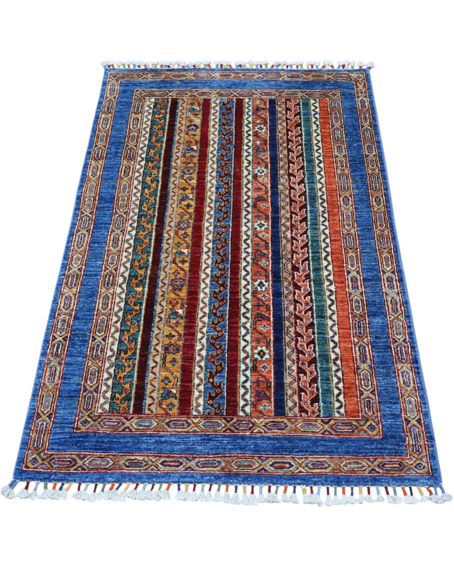 Tappeto Shirvan caucasico 155x95 cm annodato a mano, fondo blu con righe verticali multicolore e motivi geometrici tradizionali
