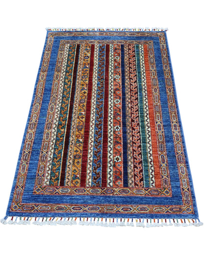 Tappeto Shirvan caucasico 155x95 cm annodato a mano, fondo blu con righe verticali multicolore e motivi geometrici tradizionali