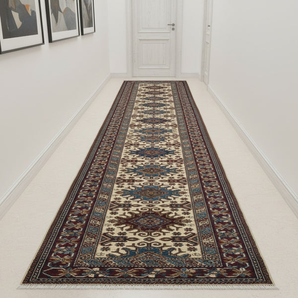 Tappeto Shirvan annodato a mano 301x83 cm in lana con fondo beige, cornice rossa e motivi geometrici tradizionali afgani.