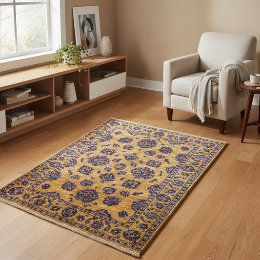 Tappeto Farahan Ziegler oro e blu notte, annodato a mano in Afghanistan. Realizzato in lana e cotone con colori vegetali, unisce eleganza floreale e tradizione artigianale.