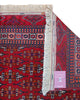 Tappeto Bokhara 280x180 cm con fondo rosso intenso e motivi geometrici blu, nero e avorio, tramato ed annodato a mano, provenienza Asia Centrale.