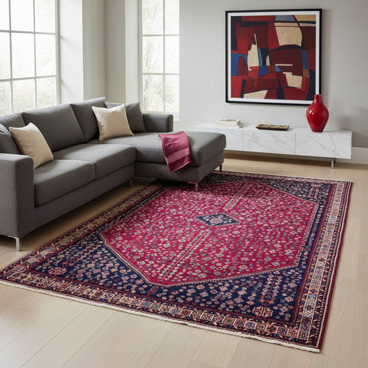 Tappeto Abadeh 301x200 cm, fondo rosso con grande medaglione geometrico e angoli blu, annodato a mano.