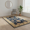 Tappeto Ziegler 178x122 cm con motivo floreale su fondo blu scuro e bordura beige, ideale per arredamenti eleganti.